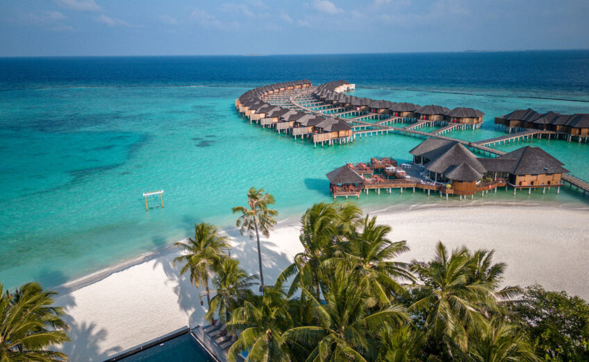 Calm ocean waters with limestone cliffs in Asia, perfect for tranquil, exotic luxury getaways.