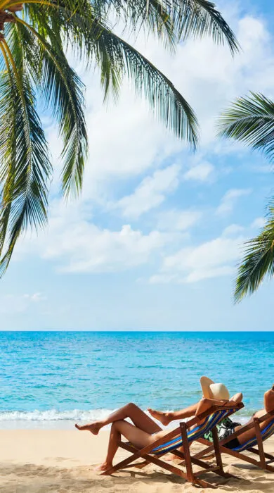 Luxury beach vacation in tropical destination with turquoise water, white sand, and upscale travel amenities