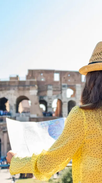 Iconic Colosseum in Rome under clear sky, representing luxury European travel and historic exploration