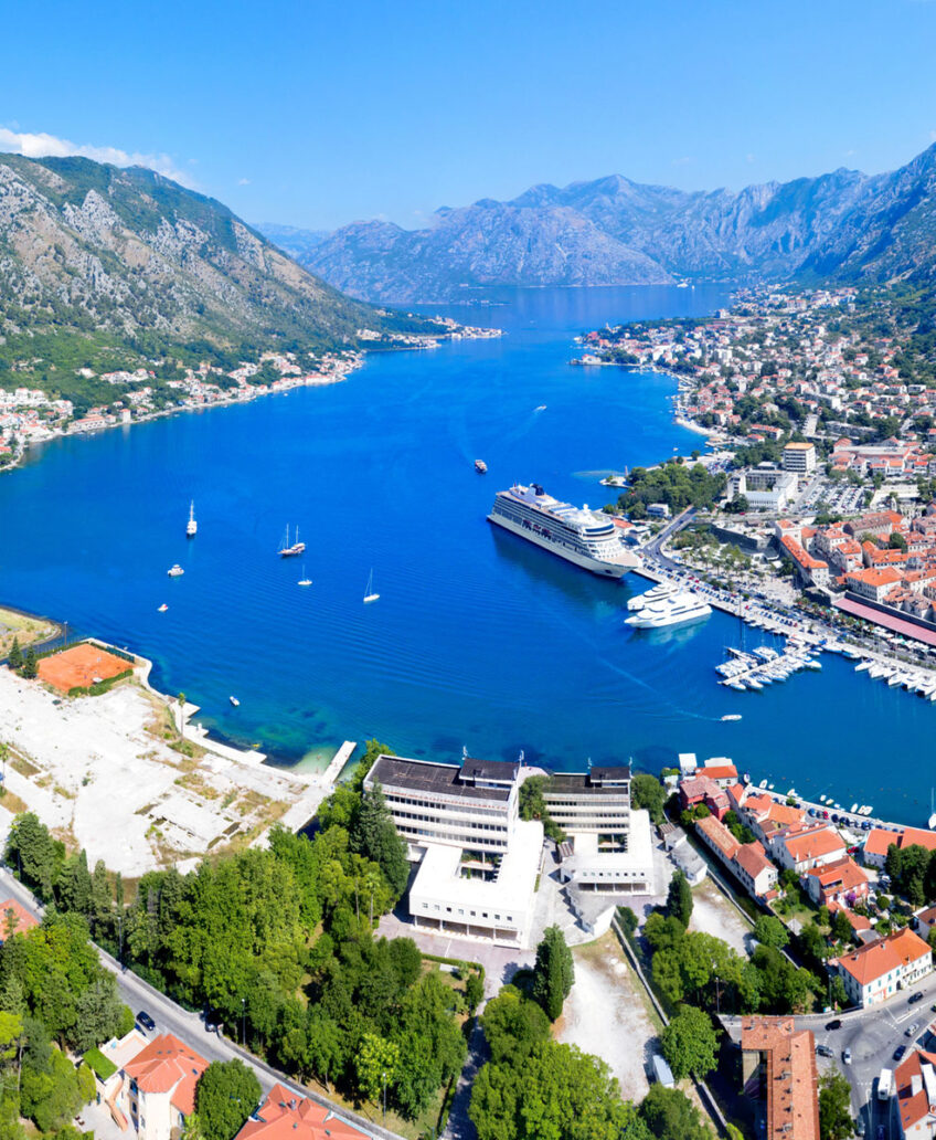 Elegant cruise ship at sunset with Travel Adventures Unlimited, offering luxury travel experiences and breathtaking ocean views