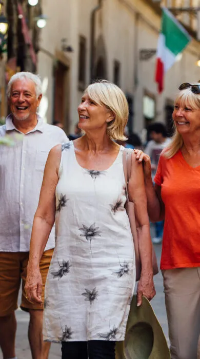 Elegant group travel with friends touring a cultural site, ideal for upscale shared vacation experiences