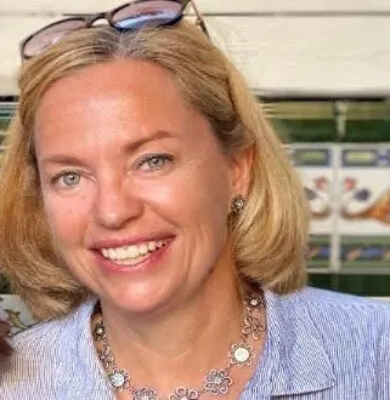 Helene Zweidinger, travel advisor at Travel Adventures Unlimited, smiling in a professional portrait