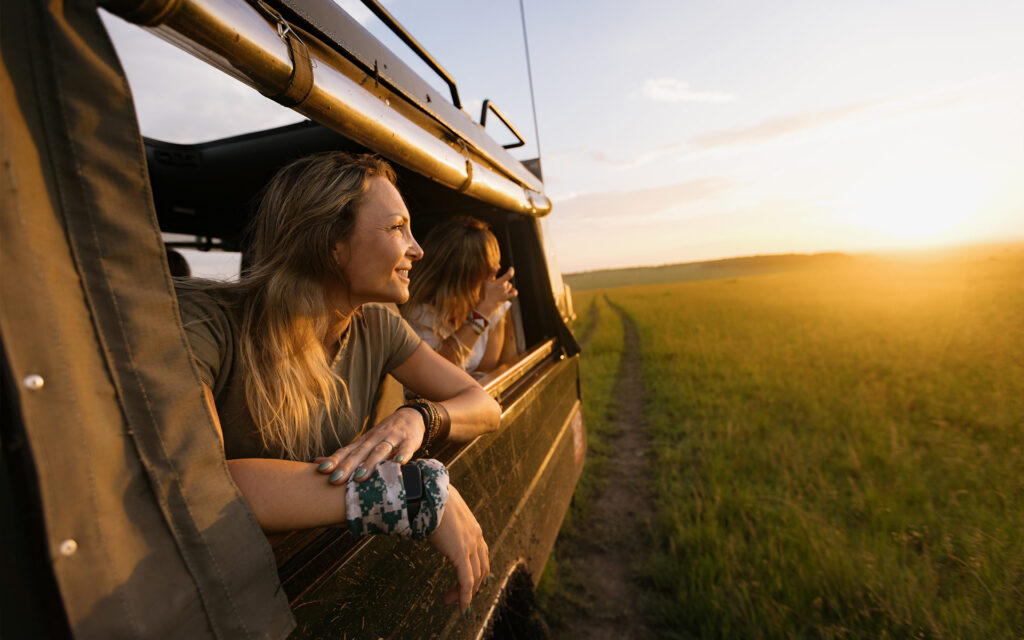 Group of women on luxury African safari, enjoying wildlife viewing and adventure in style.