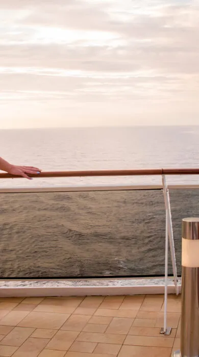Woman relaxing on the deck of a small ship cruise with Travel Adventures Unlimited, enjoying luxury travel from Walnut Creek and San Francisco