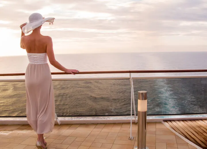 Woman relaxing on the deck of a small ship cruise with Travel Adventures Unlimited, enjoying luxury travel from Walnut Creek and San Francisco