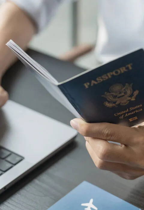 Traveler holding a passport ready for international luxury travel adventure