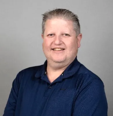 Paul Osborne, travel advisor at Travel Adventures Unlimited, smiling in a professional headshot