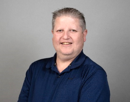 Paul Osborne, travel advisor at Travel Adventures Unlimited, smiling in a professional headshot