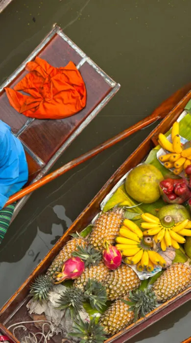 Travelers participating in a hands-on cooking class, preparing traditional dishes during a culinary tour.