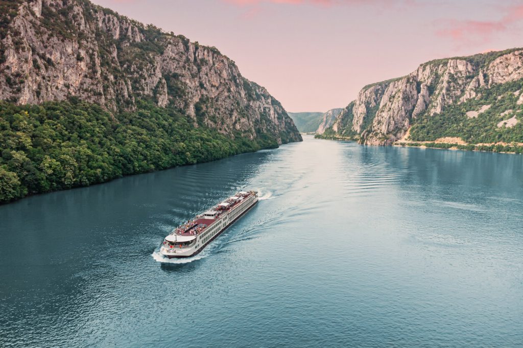 AmaWaterways river cruise sailing through the scenic Danube River Gorge — luxury river cruises Europe, AmaWaterways 2025 itineraries, Danube River cruise vacation.
