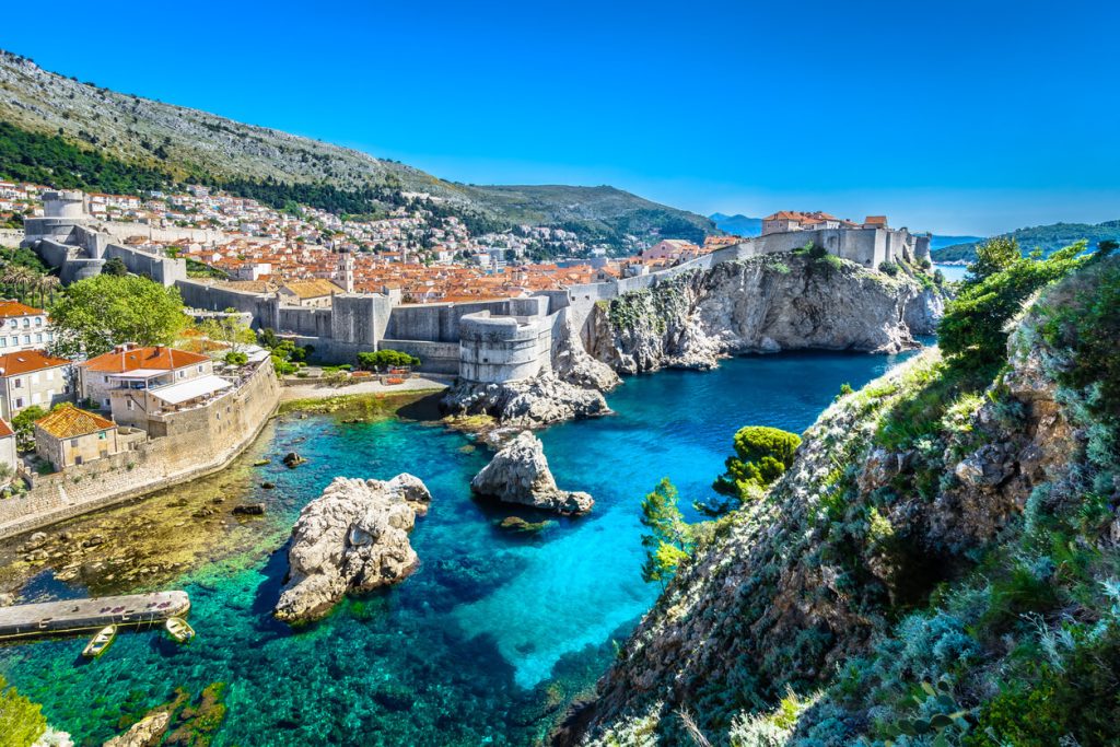 Scenic view of Dubrovnik, Croatia with medieval walls and turquoise Adriatic Sea — Croatia vacations, Mediterranean travel, and 2025 Europe itineraries.