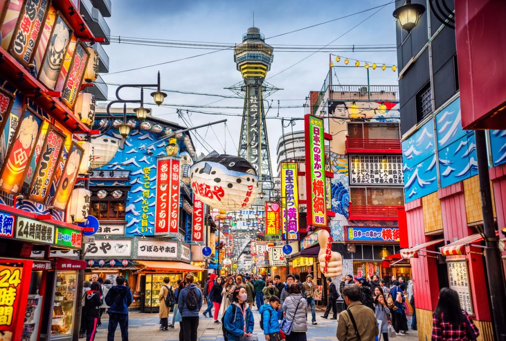 Vibrant street scene in Osaka, Japan with Tsutenkaku Tower — Japan travel, cultural tours, and 2025 Asia vacation itineraries.